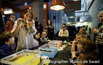 Mad Scientist working in a lab with tons of smoke pouring out of beakers