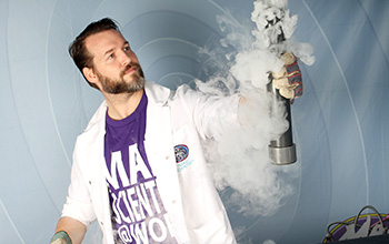 Mad scientist holding a tube with smoke surrounding it